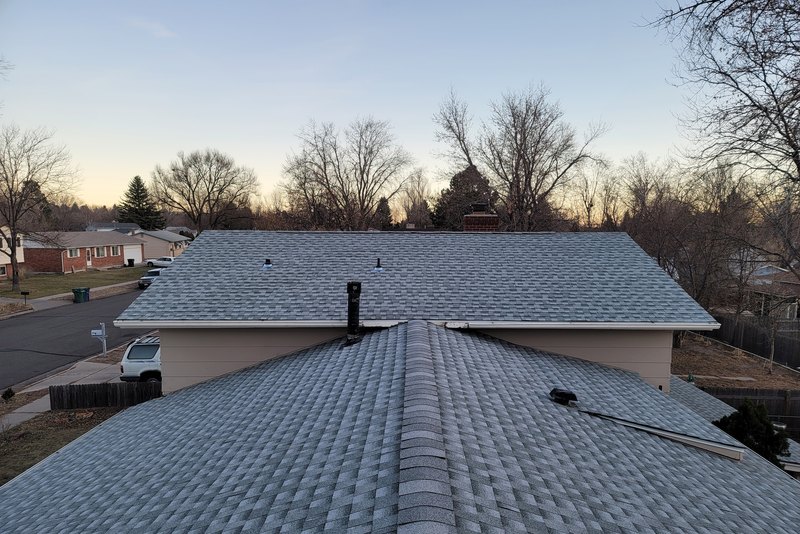 Gray shingle roof above a garage, ridge and edge courses sound